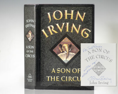"The more clearly one sees this world; the more one is obliged to pretend it does not exist": First Edition of The Son of The Circus; Warmly Inscribed by John Irving