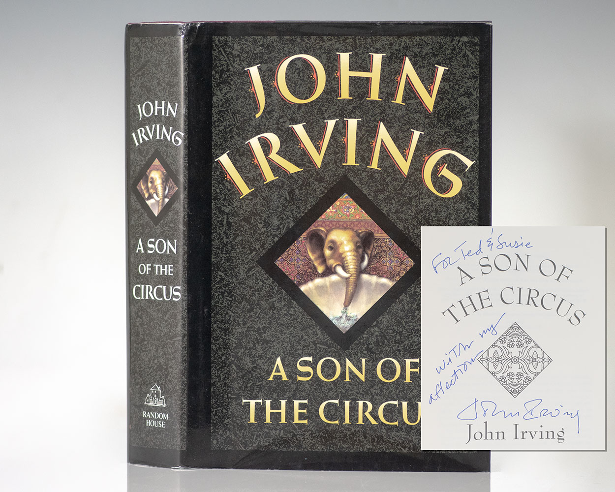 "The more clearly one sees this world; the more one is obliged to pretend it does not exist": First Edition of The Son of The Circus; Warmly Inscribed by John Irving