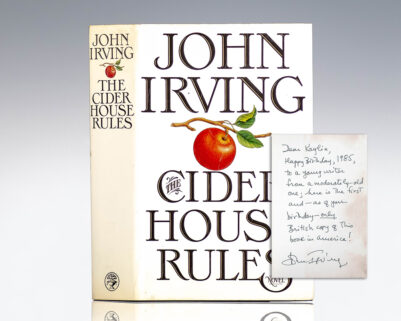 "Happy Birthday, 1985, to a young writer from a moderately-old one; here is the first and-as of your birthday-only British copy of this book in America!": First Edition of The Cider House Rules; With a Full Page Inscription by John Irving
