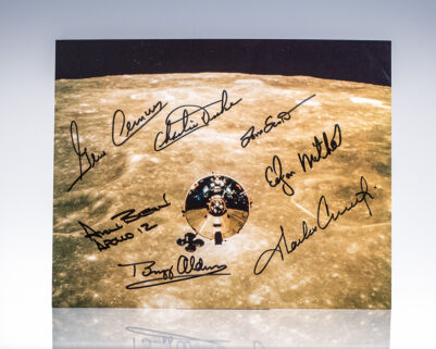 Photo of Apollo spacecraft orbiting the Moon signed by astronauts